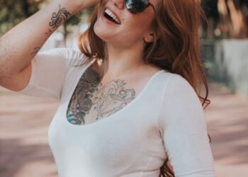 A girl is smiling on a street